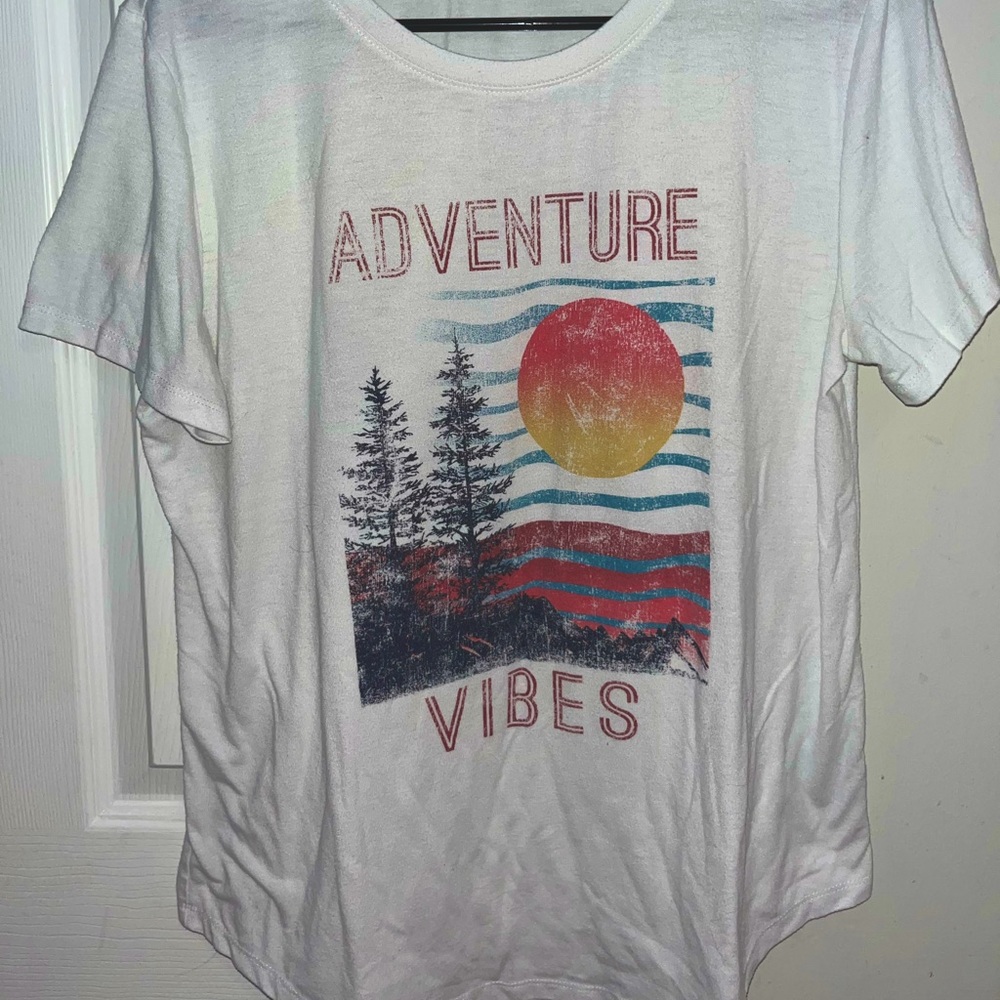 White Tee. Fits like a large.